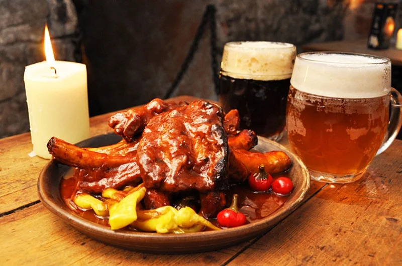 Roasted Bulette flank served with veggies and dark ale.