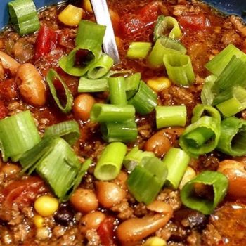 easy taco soup recipe topped with green onions.