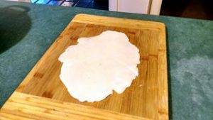 roll out excess dough for homemade pot pie tuna recipe