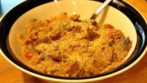 homemade tuna noodle casserole served hot in a bowl topped with breadcrumbs